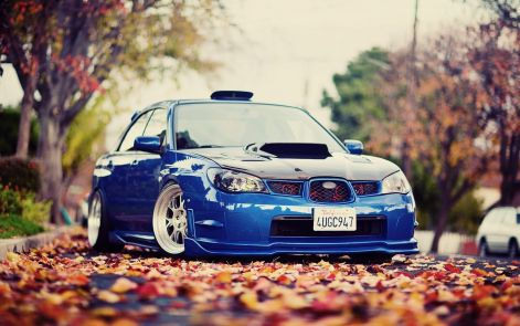 subaru-wrx-tuning-blue-car-autumn-leaves-1680x1050.jpg